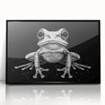 Framed wall art featuring a vibrant frog design with a black acrylic frame, showcasing a colorful wildlife theme perfect for nature enthusiasts and home decor.