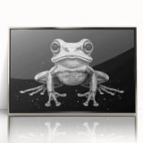Framed wall art featuring a detailed illustration of a vibrant green frog set against a sleek silver background, ideal for modern home decor or wildlife enthusiasts.