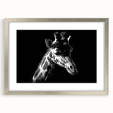 Silver-framed wall art featuring a giraffe design, showcasing a vibrant, colorful depiction of wildlife. The artwork is elegantly matted, perfect for home decor.
