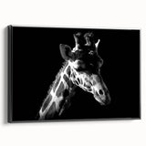 Framed canvas wall art showcasing a striking black and white design of a giraffe in profile, perfect for animal lovers and modern decor enthusiasts.