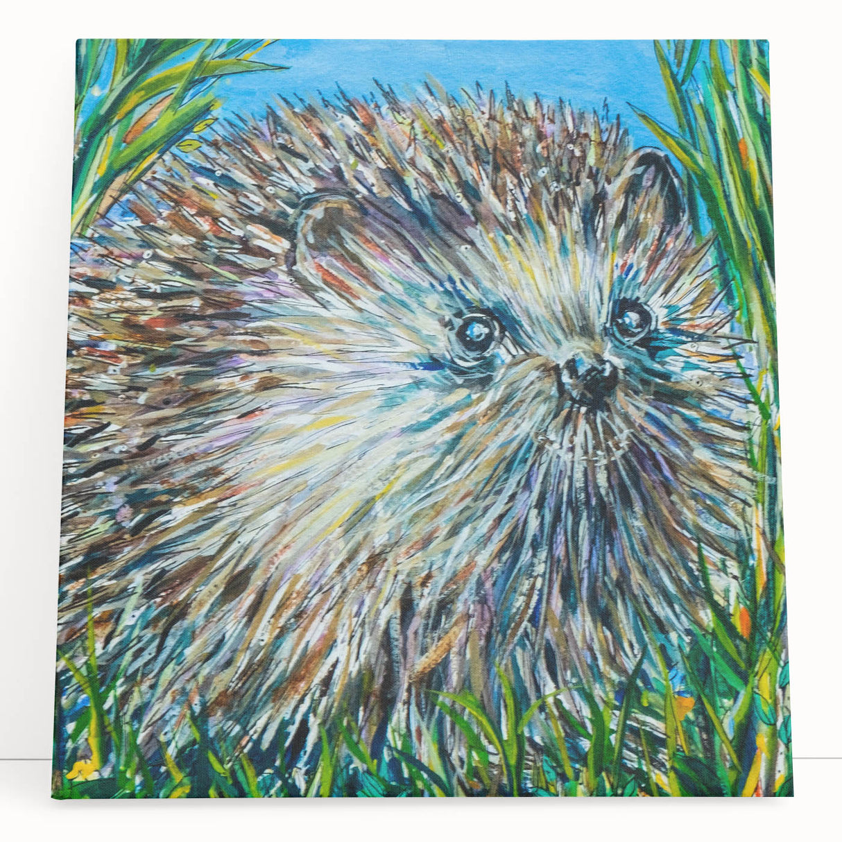 Stretched canvas wall art featuring a whimsical hedgehog design in vibrant colors, perfect for nature-themed decor. Ideal for animal lovers and home accents.