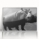 Framed wall art showcasing a vibrant hippopotamus design in a white frame, featuring a detailed front view of the animal against a colorful background, perfect for wildlife enthusiasts.