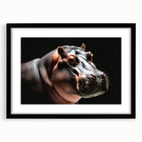 Black-framed wall art print showcasing a beautifully designed hippopotamus in a vibrant jungle setting, perfect for animal lovers and home decor enthusiasts.