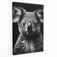 Stretched canvas wall art featuring a serene koala design, showcasing soft gray and green tones, ideal for nature-themed decor in homes or offices.