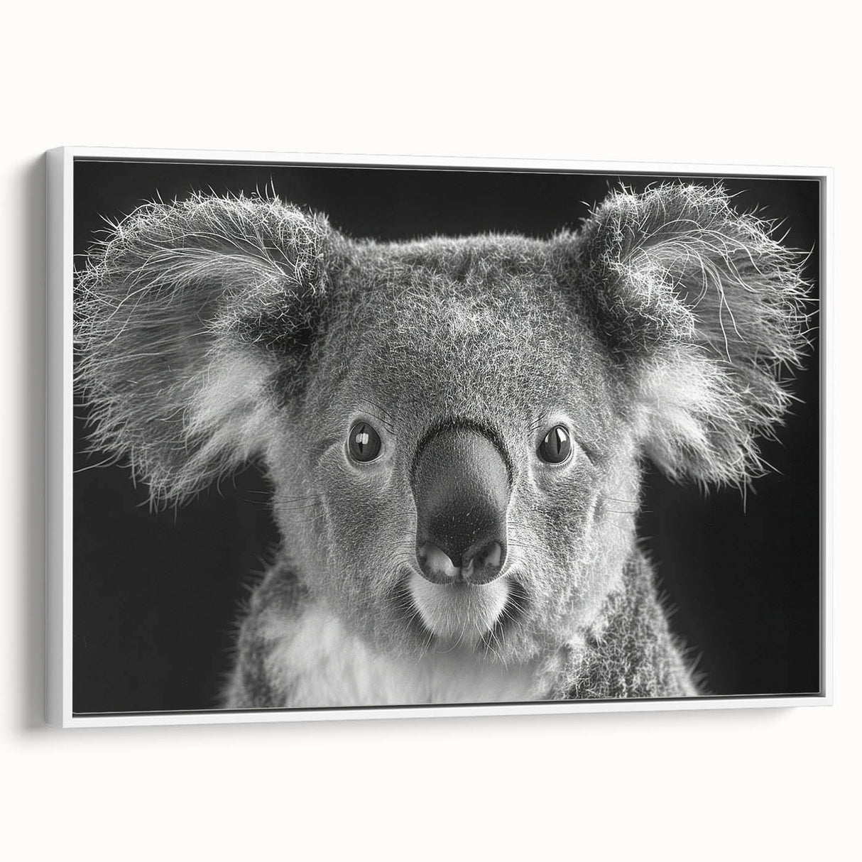 Framed wall art showcasing a koala design on canvas, featuring vibrant colors and a white frame, ideal for animal lovers and nature-themed decor.