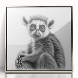 Framed acrylic wall art featuring a vibrant lemur design, showcasing the animal's playful nature against a sleek silver frame, ideal for wildlife enthusiasts.