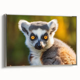 Framed canvas wall art showcasing a vibrant lemur design in a silver frame, highlighting the playful nature of wildlife. Ideal for animal lovers' decor.