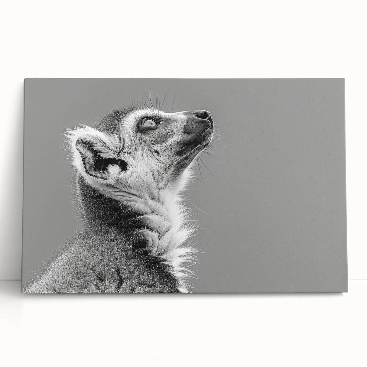 Colorful stretched canvas wall art featuring a whimsical lemur design, showcasing vibrant greens and playful patterns, perfect for animal lovers' home decor.