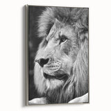 Framed canvas wall art featuring a striking side view of a majestic lion, showcasing intricate details and a silver frame, ideal for wildlife enthusiasts and home decor.