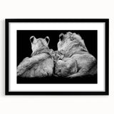 Framed wall art featuring a majestic lion design in black and gold, set against a striking white background, perfect for wildlife enthusiasts and modern decor.