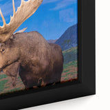 Close-up of a framed canvas print showcasing a detailed moose and elk design, featuring vibrant colors and intricate textures, perfect for wildlife art enthusiasts.