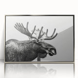 Framed wall art featuring a moose and elk design in a silver-acrylic finish, showcasing detailed wildlife imagery ideal for nature enthusiasts' decor.