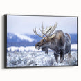 Framed canvas wall art showcasing a moose and elk design, featuring intricate details and a black frame, perfect for nature lovers and wildlife enthusiasts.