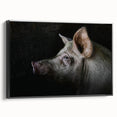 Framed wall art featuring a whimsical pig design in vibrant colors, set against a sleek black background, ideal for adding a playful touch to home decor.