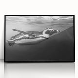 Framed wall art featuring a striking penguin design in a black acrylic frame, showcasing vibrant colors and intricate details that enhance any modern decor.