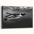 Framed canvas wall art showcasing a side view of a whimsical penguin design, featuring vibrant colors on a black background, perfect for animal lovers and home decor enthusiasts.