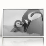 Framed wall art featuring a modern penguin design in a white frame, showcasing vibrant colors and sleek acrylic finish, perfect for animal-themed decor.