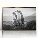Framed acrylic wall art featuring a whimsical penguin design with gold accents, perfect for children's rooms or playful decor, set against a clear backdrop.