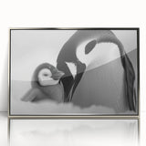 Framed wall art featuring a playful penguin design with a silver acrylic finish, ideal for adding a whimsical touch to modern decor, perfect for animal lovers.