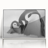 Framed acrylic wall art showcasing a whimsical penguin design from the "Animals of Wildlife" collection, prominently displayed with a sleek white frame, perfect for modern decor.