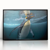 Framed wall art featuring a playful penguin design in a modern black frame, showcasing vibrant colors and whimsical details, perfect for animal lovers and home decor.
