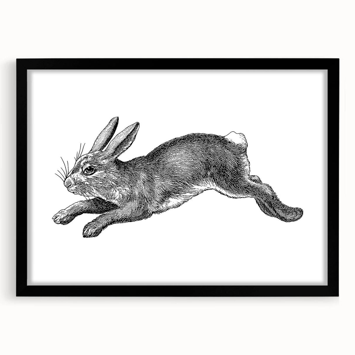 Black-framed wall art featuring a whimsical rabbit design, elegantly matted, suitable for home decor. Ideal for animal lovers and contemporary interiors.
