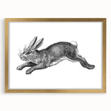 Elegant wall art featuring a whimsical rabbit design in a gold frame, showcasing intricate details and a stylish mat, perfect for animal lovers and home decor enthusiasts.