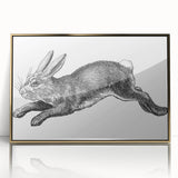 Framed wall art featuring a whimsical rabbit design in vibrant colors, accented with a gold border, perfect for adding a playful touch to home decor.