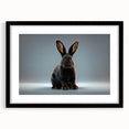Framed wall art featuring a stylish rabbit design in a minimalistic black frame, set against a white mat, perfect for modern home decor. Ideal for animal lovers and nature enthusiasts.