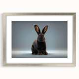 Framed wall art featuring a whimsical rabbit design in a silver frame, showcasing intricate details and a stylish mat for an elegant display in any room.