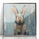 Framed wall art featuring a stylized rabbit design, with a sleek silver acrylic front and modern aesthetics, ideal for enhancing contemporary home decor.