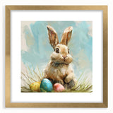 Framed wall art featuring a whimsical rabbit design in a gold frame with matting, perfect for children's decor or animal-themed rooms, showcasing vibrant colors and playful details.