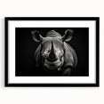 Framed wall art featuring a black-and-white rhinoceros design, showcasing intricate details and textures, perfect for animal lovers and modern home decor.