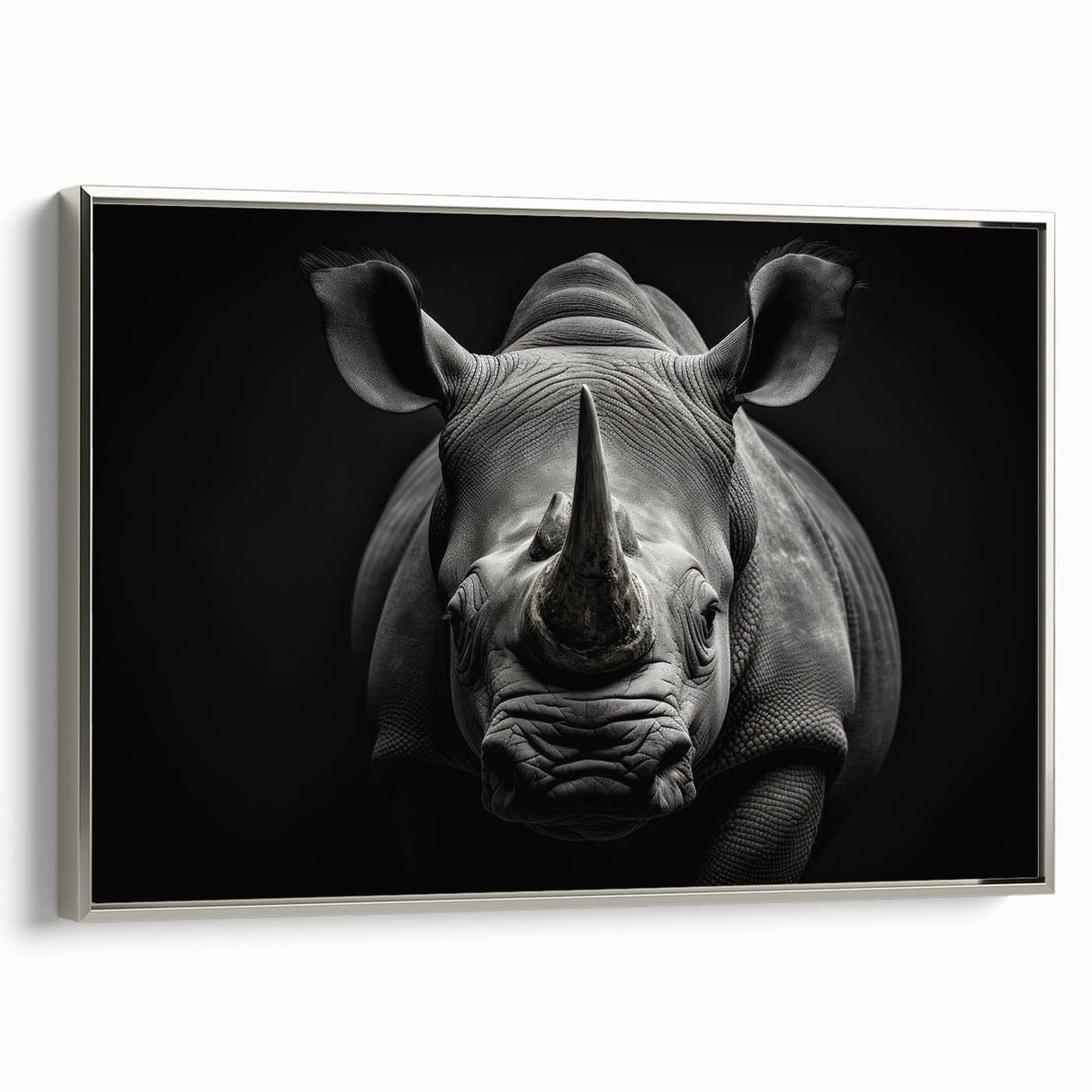 Framed canvas wall art showcasing a silver side view of a rhinoceros, emphasizing its details and textures, perfect for wildlife enthusiasts and modern decor.
