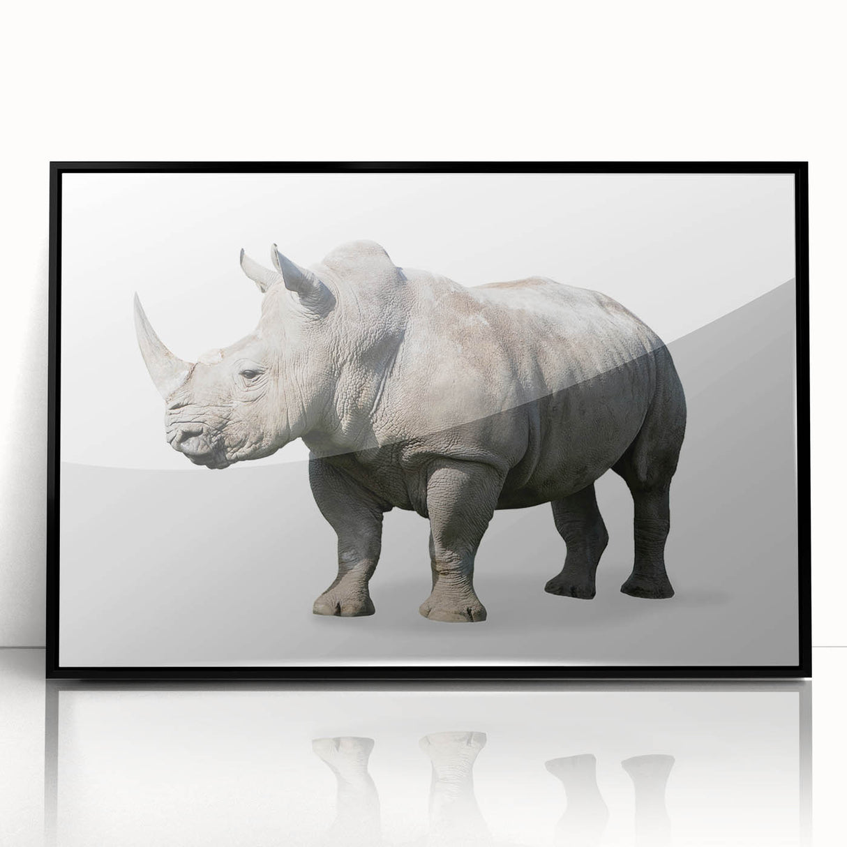 Framed wall art showcasing a striking black rhinoceros design, featuring intricate details and a sleek acrylic finish, perfect for enhancing modern decor.