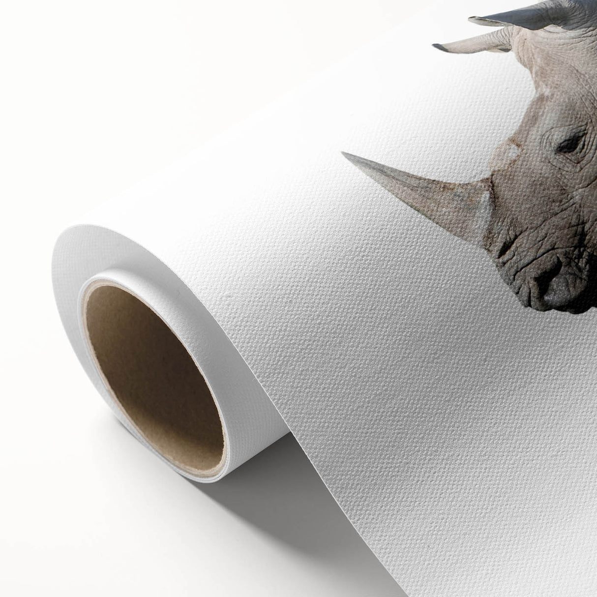 Rolled canvas artwork showcasing a striking rhinoceros design, featuring vivid colors and intricate details, perfect for wildlife enthusiasts and home decor.