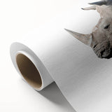 Rolled canvas artwork showcasing a striking rhinoceros design, featuring vivid colors and intricate details, perfect for wildlife enthusiasts and home decor.
