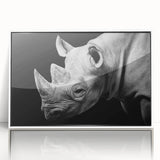 Framed wall art featuring a white-front view of a rhinoceros design, showcasing intricate details and vibrant colors, perfect for wildlife enthusiasts and modern decor.