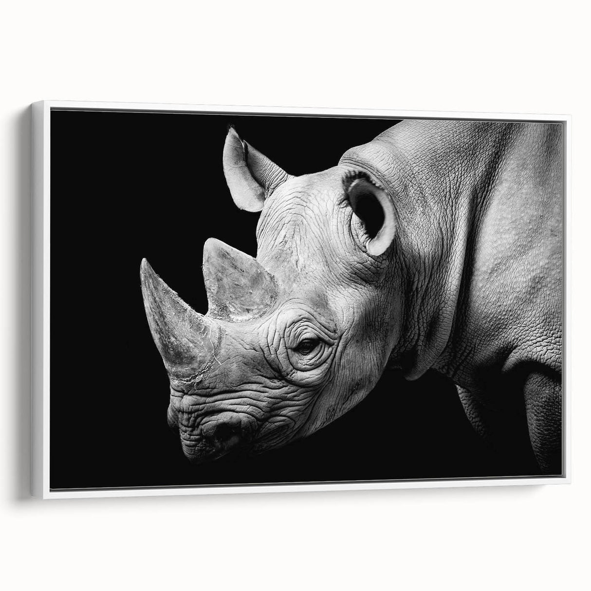 Framed wall art featuring a side view of a rhinoceros in a minimalist design, showcasing earthy tones and sleek lines, perfect for animal lovers and modern decor.