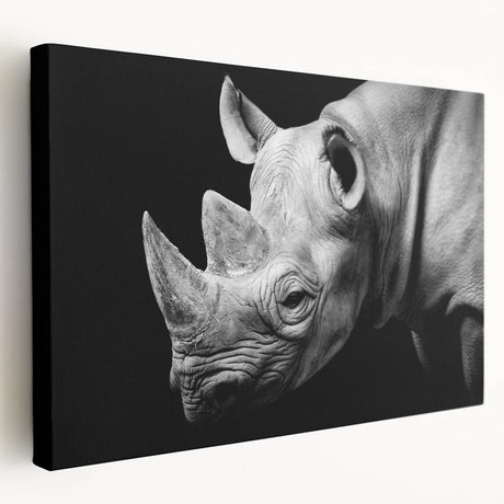 Stretched canvas wall art featuring a side view of a rhinoceros in a vibrant, colorful design, perfect for wildlife enthusiasts and home decor.