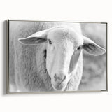 Framed wall art featuring a silver-framed canvas of a serene sheep design, showcasing intricate details and a tranquil color palette, ideal for home decor.