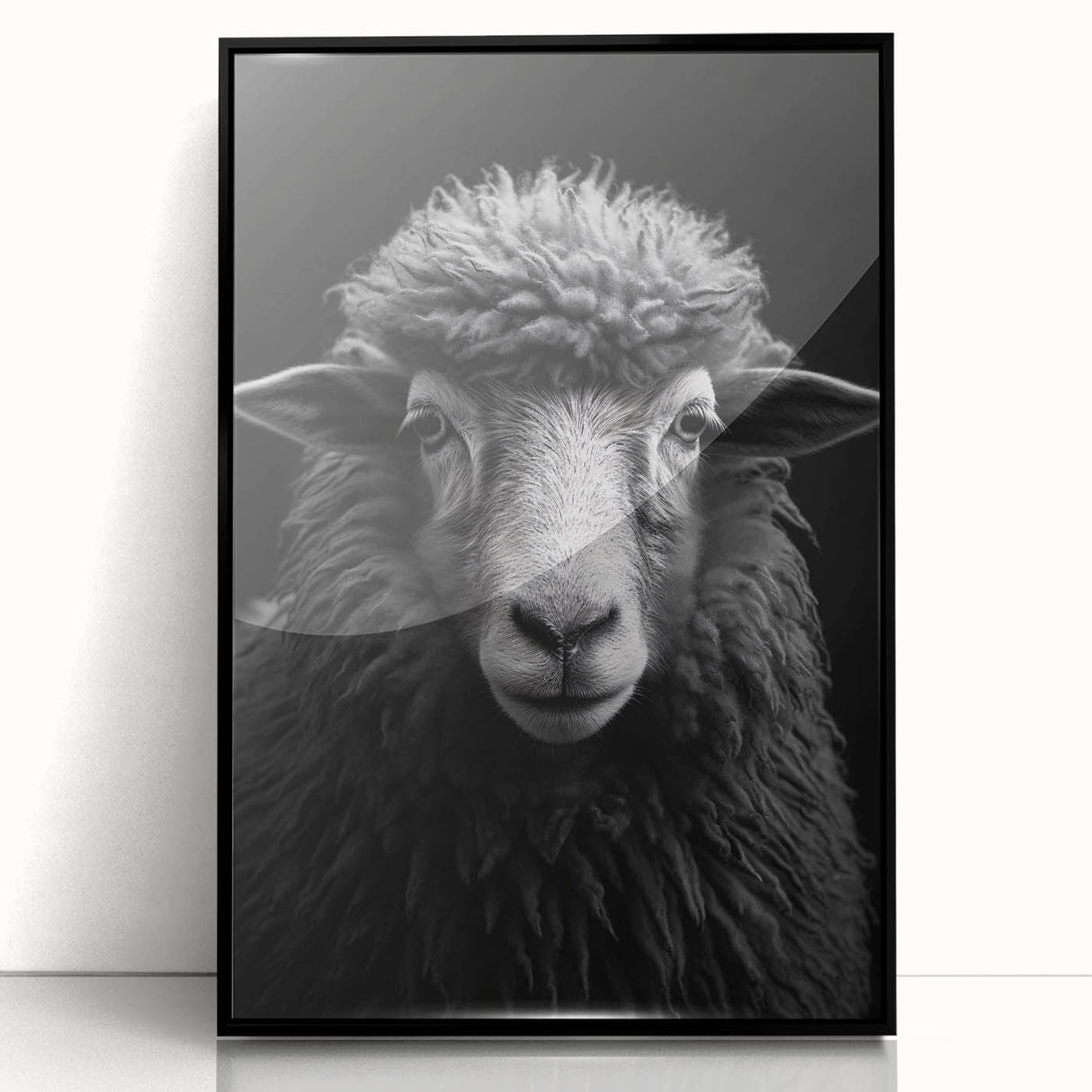 Framed wall art featuring a black acrylic design of a sheep, showcasing intricate details and textures, perfect for adding a rustic charm to home decor.