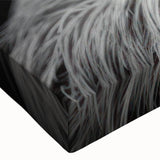 Close-up of a stretched canvas featuring a vibrant sloth design from the "Animals: A Wild Life" collection, showcasing detailed textures and colors perfect for nature-themed decor.