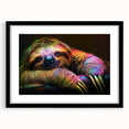 Framed wall art featuring a sloth design from the "Animals: A Wild Life" collection, set in a sleek black frame with a white mat, ideal for nature enthusiasts.