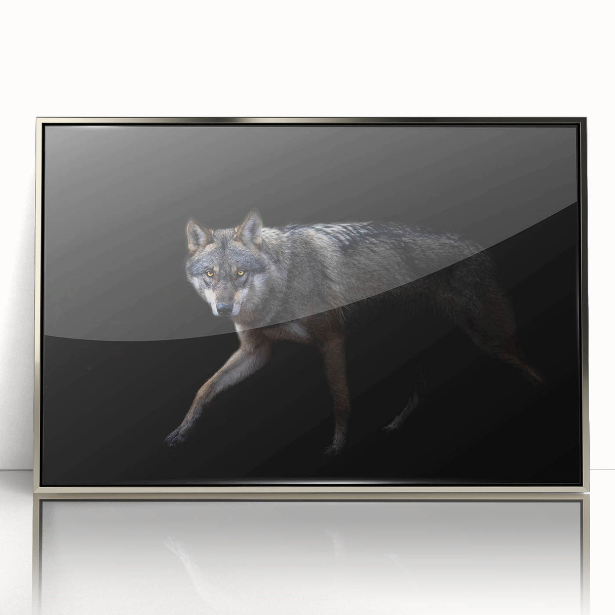 Framed wall art featuring a striking wolf design in acrylic, showcasing intricate details and a silver frame, perfect for wildlife enthusiasts and modern decor.