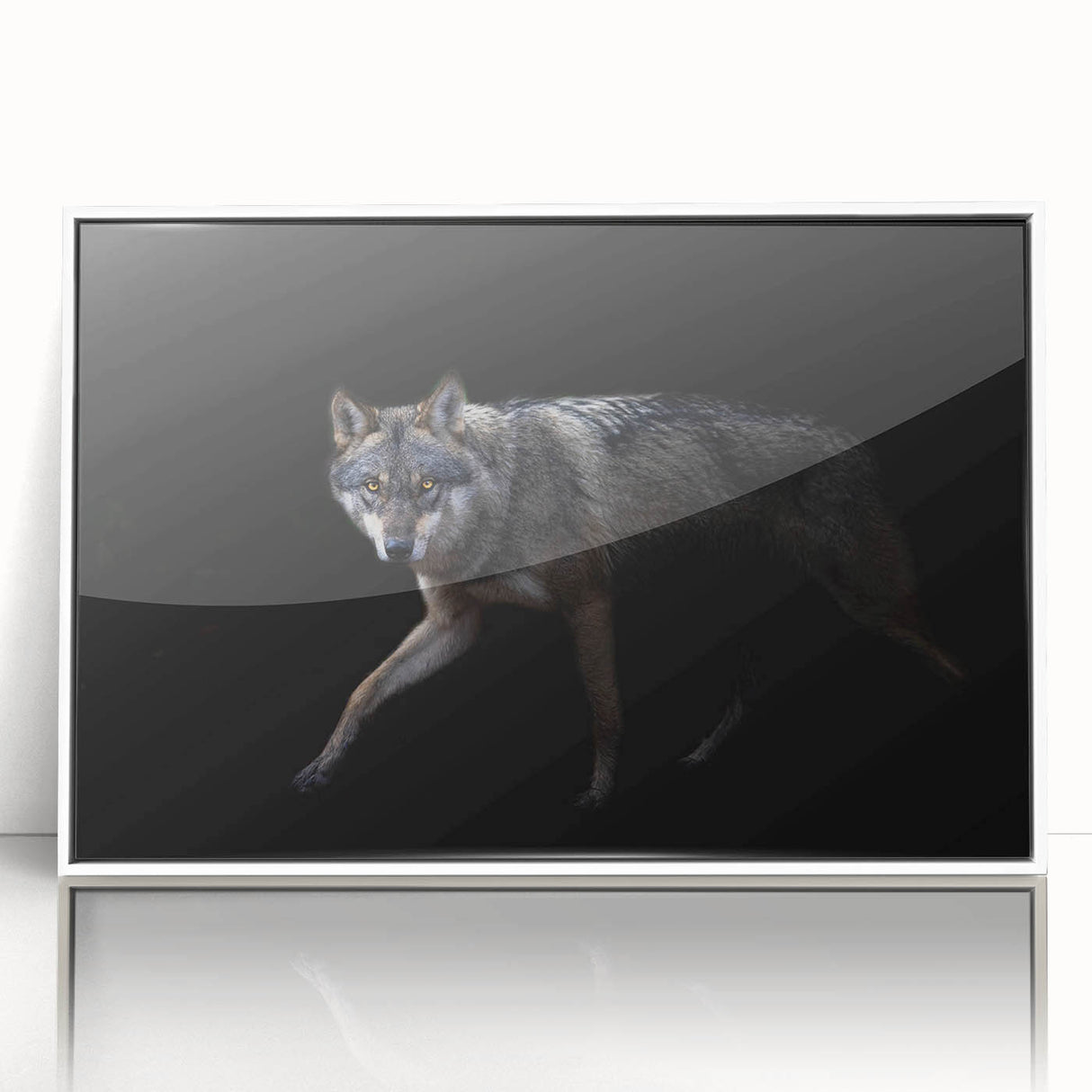Framed wall art featuring a striking wolf design in black and white, showcasing intricate details on acrylic, perfect for nature enthusiasts and wildlife decor.