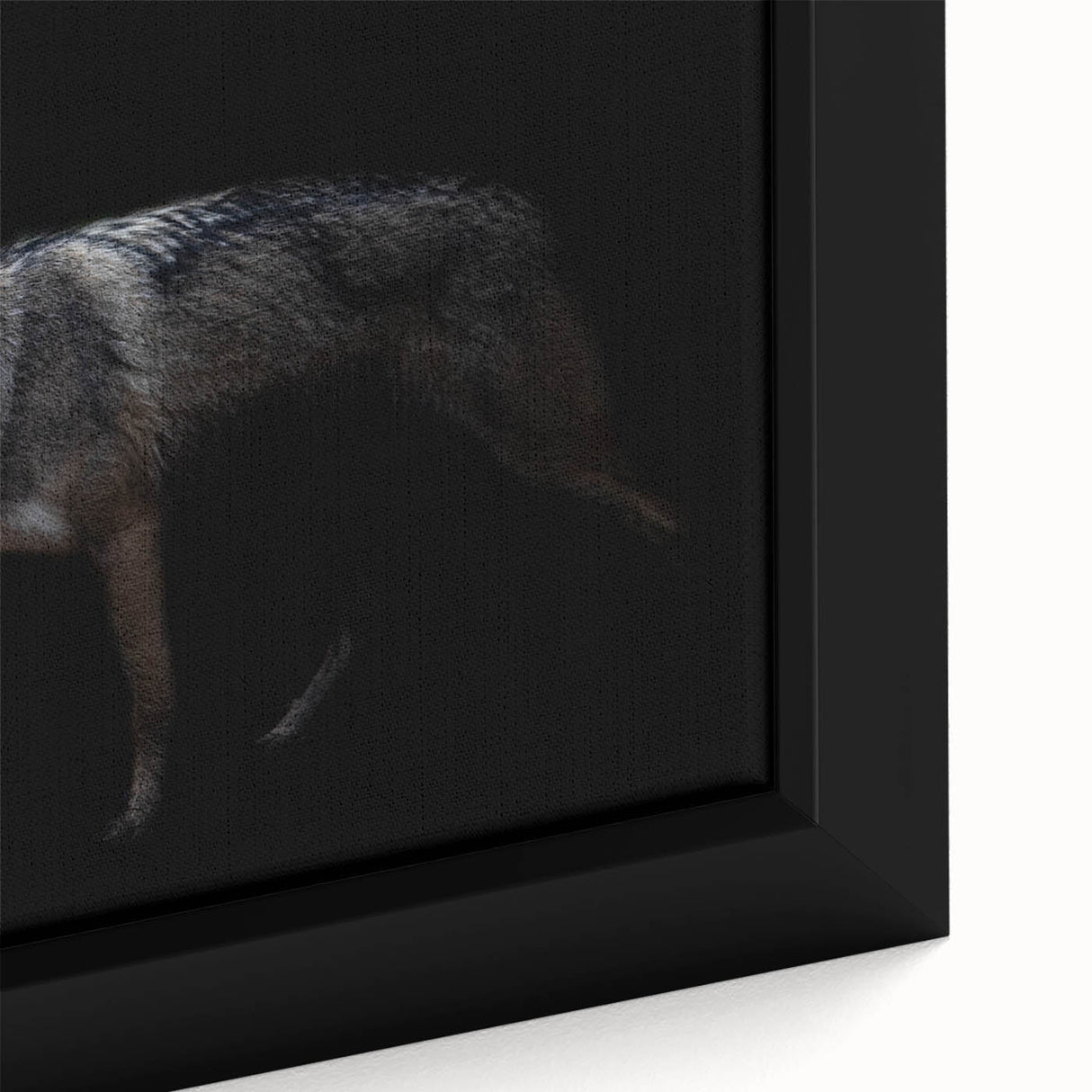 Close-up of a framed canvas wall art featuring a striking wolf design, showcasing intricate details and vibrant colors, perfect for animal lovers and home decor enthusiasts.