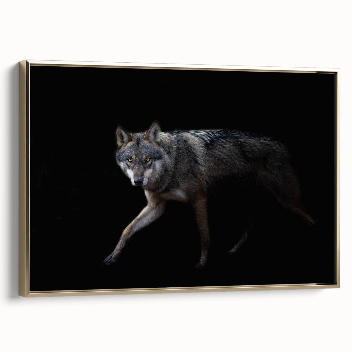 Framed wall art showcasing a striking wolf design in a gold frame, emphasizing intricate details and textures, perfect for wildlife enthusiasts and modern decor.