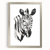 Framed wall art featuring a striking zebra design in black and white, set in a sleek silver frame with a mat, perfect for adding a touch of wildlife elegance to modern decor.