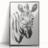 Framed wall art featuring a striking zebra design, showcasing bold black and white stripes with a gold-accented frame, ideal for modern decor.